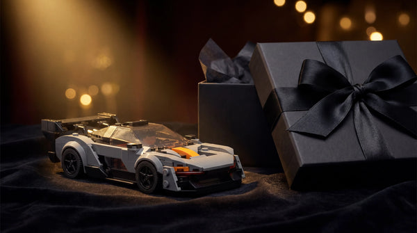 McLaren Senna 1:24 scale LEGO-compatible brick building kit presented as a premium automotive gift — best car building kit gift for car enthusiasts